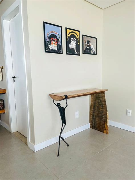 A Wooden Table Sitting In The Middle Of A Living Room Next To A Wall