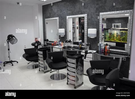 The Luminous Interior Of A Beauty Salon With Three Armchairs Set Up In