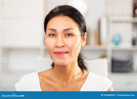 Portrait Of A Positive Asian Business Woman In Office Stock Photo