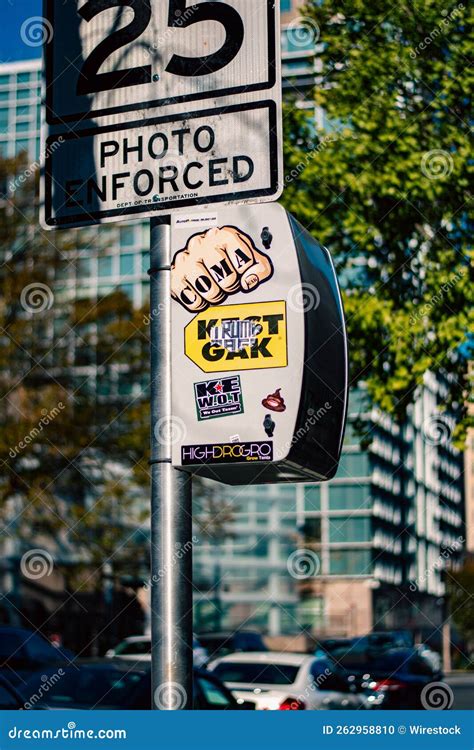 Vertical of a Board in the Street with Stickered Objects on the Street ...