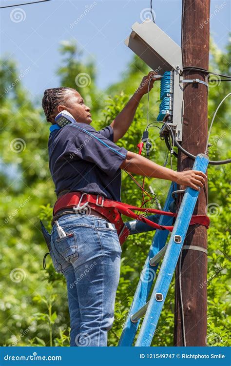 Telephone Engineer Working On Telephone Poll Editorial Photography