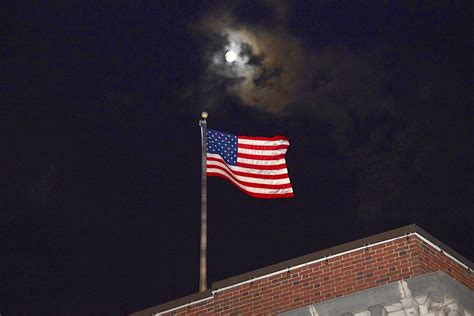 Flag Waving Against The Full Moon Backdrop — The Westport Local Press