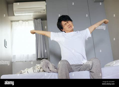 Japanese man waking up Stock Photo - Alamy