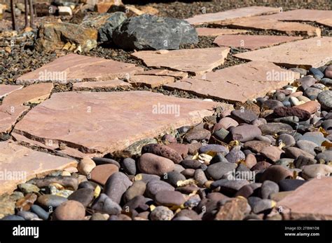 Yard landscape project with flagstone and gravel flooring installed ...