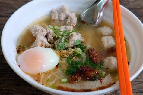 Fine Cut White Rice Noodle Clear Soup With Egg Fish Ball And Pork