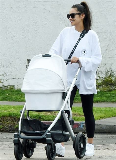 Shay Mitchell Street Style In A Brand Logo White Leather Lace Up