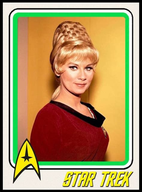 A Star Trek Card With A Woman Wearing A Red Dress And Braid In Her Hair