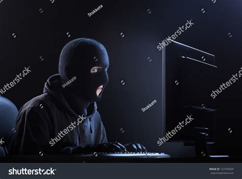 Computer Hacker Male Thief Stealing Data From Computer Stock Photo