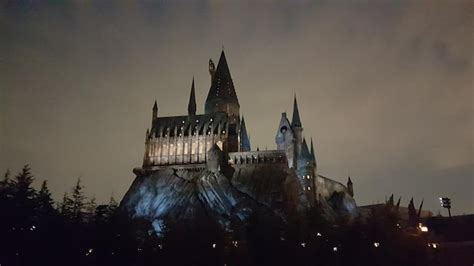 Premium Photo | The hogwarts castle at night with a light on it