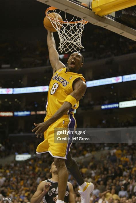 Kobe Bryant of the Los Angeles Lakers slam dunks during game two of ...