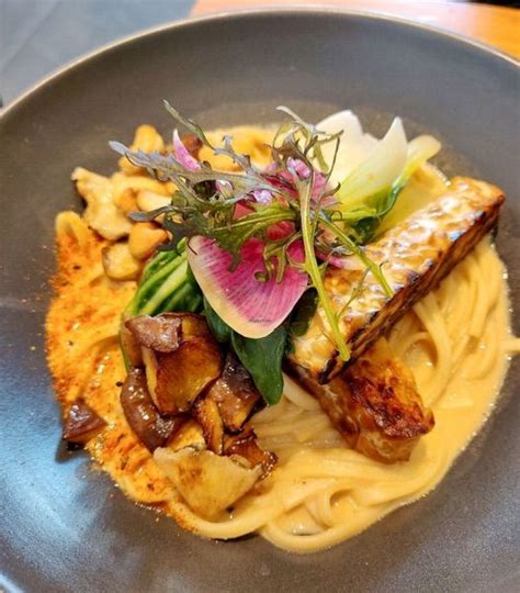 A Plate That Has Some Food On Top Of It And Is Sitting On A Table