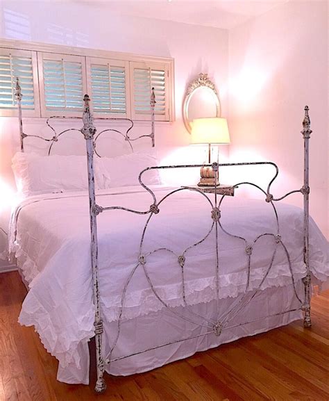 Embracing The Original Chipped Finish Of Vintage Iron Beds