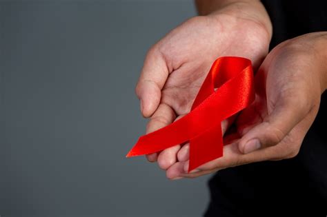 Free Photo Woman Hand Holding Red Ribbon Hiv Awareness Concept World Aids Day And World Sexual