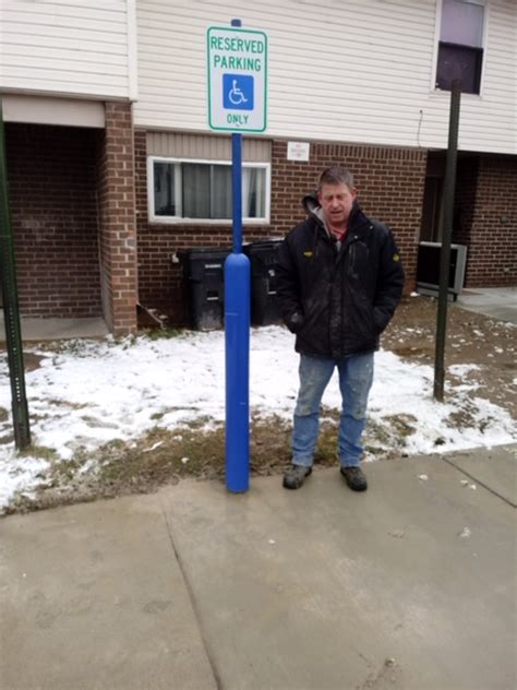 Handicap Parking Post Signs Installed For Local Construction Company In