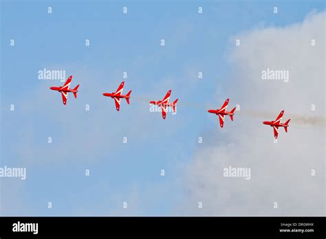 Five Red Arrows in Formation Stock Photo - Alamy