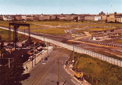 An Aerial View Of A Train Yard And Railroad Tracks In The Foreground