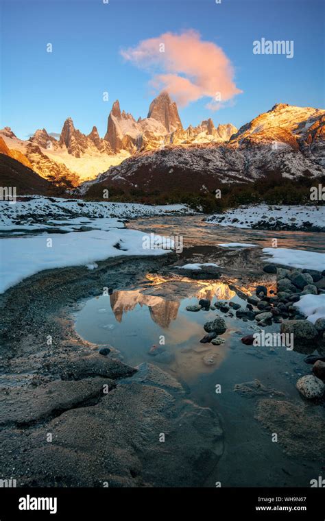 Mount Fitz Roy At Sunrise Reflected In Flowing River Los Glaciares