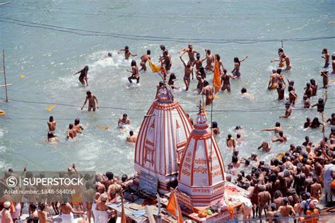 Naked Naga Sadhus Taking A Holy Bath During The Kumbha Or Kumbh Mela In