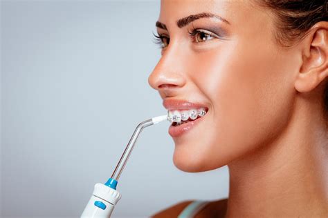 What Is A Water Flosser And How Does It Work Carrollton Orthodontics