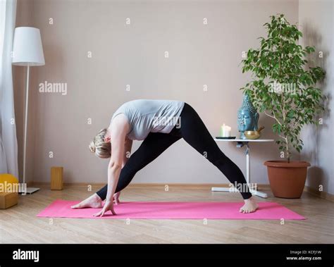 Middle Aged Or Mature Woman Doing Yoga Indoors Stock Photo Alamy