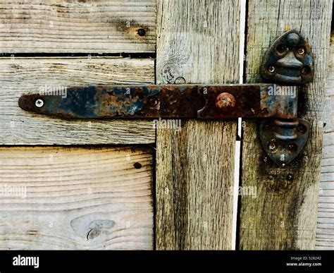 Rusty Iron Door Hinge On An Old Barn Stock Photo Alamy