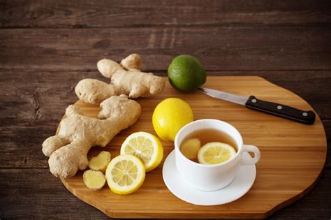 Premium Photo Cup Of Ginger Tea On A Wooden Table