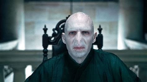 Why and how did Voldemort attach himself to Quirrell?