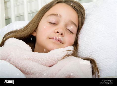 A Girl Sleeping In Bed Stock Photo Alamy