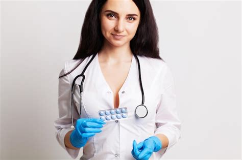 Premium Photo Sexual Health A Doctor In A White Coat Holding A Pill