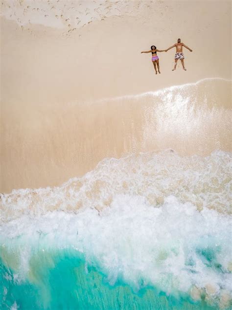 Drone View from Above at a Tropical Beach with Men and Woman Laying ...