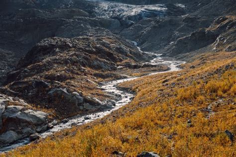 Rocky Mountains River From Glacier High Mountain Landscape With River