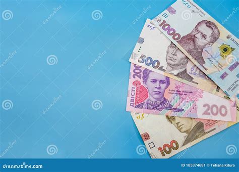 Different Ukrainian Hryvnias On A Blue Background Hryvnia With A Fan