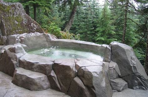 Outdoor Hot Tub Surrounded By Large Rocks