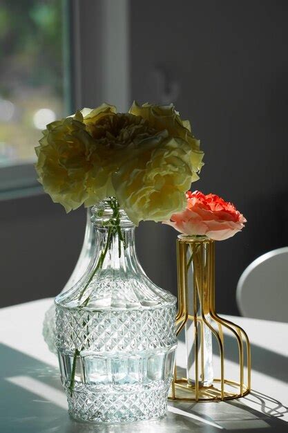 Premium Photo Close Up Of Rose In Glass Vase On Table