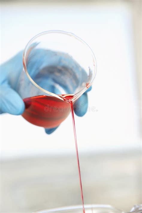 Gloved Hand Pouring Red Liquid Stock Photo Image Of Indoors Glass