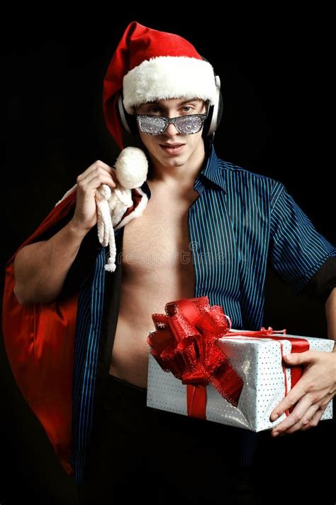 Muscular Nude Guy With Naked Torso In Santa Claus Hat Posing Indoors Stock Image Image Of