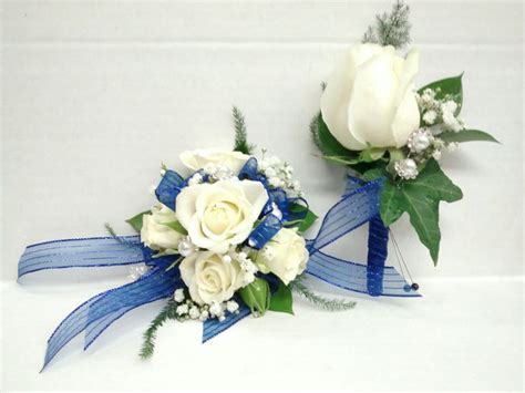 White Rose Corsage And Boutonniere With Blue Accents