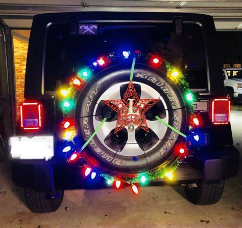 Christmas Lights Attached To Spare Tire On Jeep Wrangler Safari