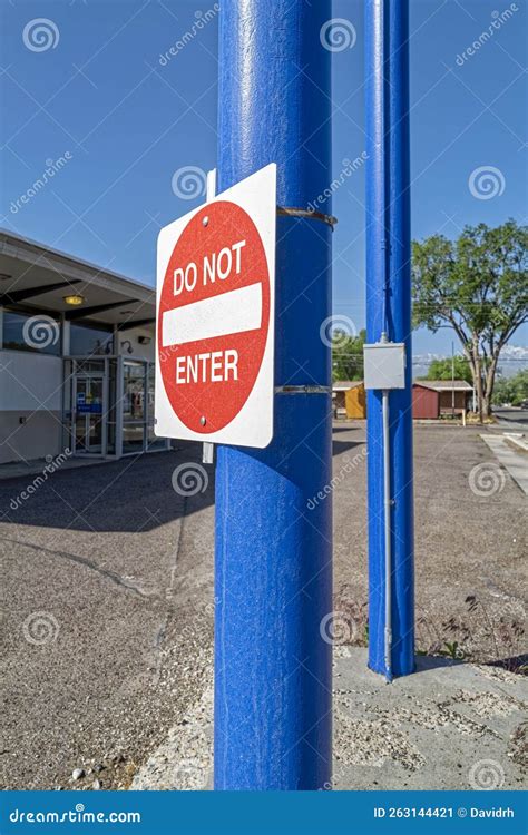 A Do Not Enter Sign On A Blue Pole Stock Image Image Of Post Block