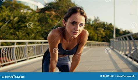 Portrait Of A Tired Girl In A Summer Sports Uniform Who Is Bending Over