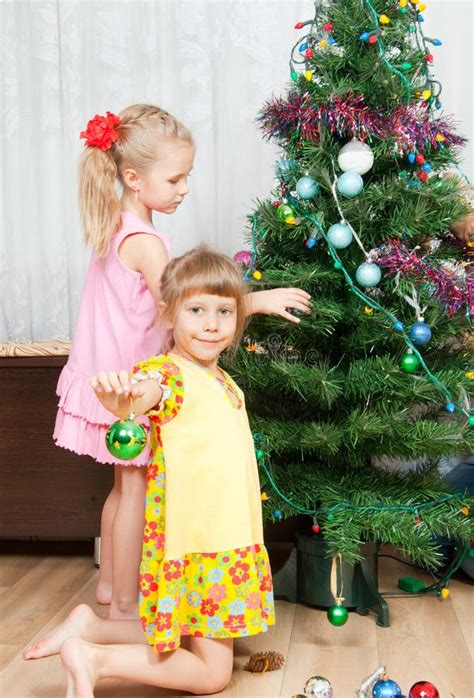 Children Decorate The Christmas Tree Stock Photo Image Of Decoration