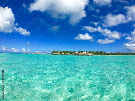 Overwater bungalows of a luxury resort at Tahaa, Tahiti, French Polynesia Stock Photo | Adobe Stock