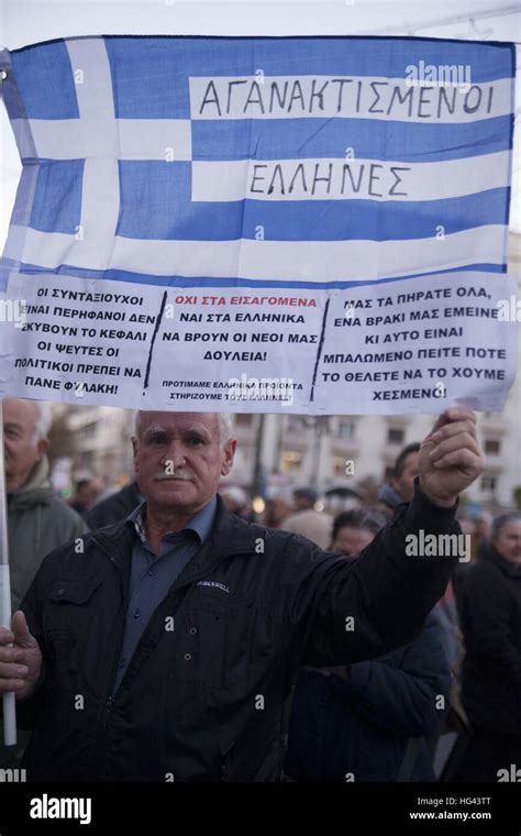 Greek Pensioner With Greek Flag Angry Greeks During Protest Of Greek