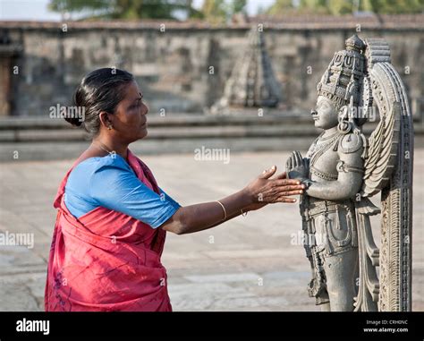 Woman Worshiping A Garuda Statue Chennakeshava Temple Belur India