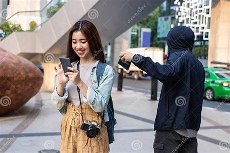 Pickpocket Thief Stealing Wallet From Backpack Of Tourist Asian Girl