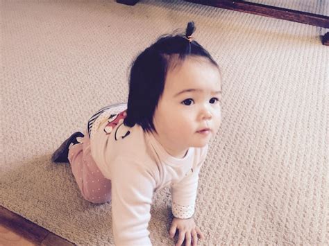 Premium Photo High Angle View Of Cute Baby Girl Kneeling On Carpet At