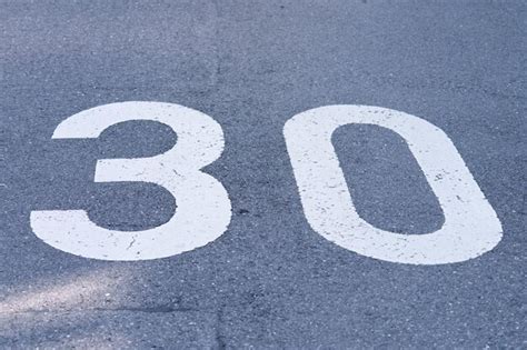 Premium Photo | Speed limit 30 sign painted on the road