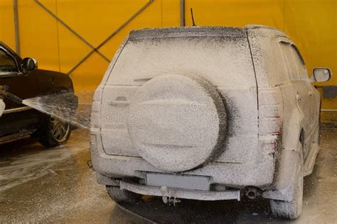 Car on a car wash in foam stock image. Image of dirty - 209430903