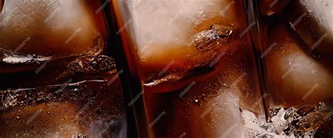 Premium Photo Cola With Ice Close Up Of The Ice Cubes In Cola Water Texture Of Carbonate Drink