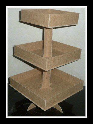 Three Cardboard Boxes Stacked On Top Of Each Other In The Shape Of A